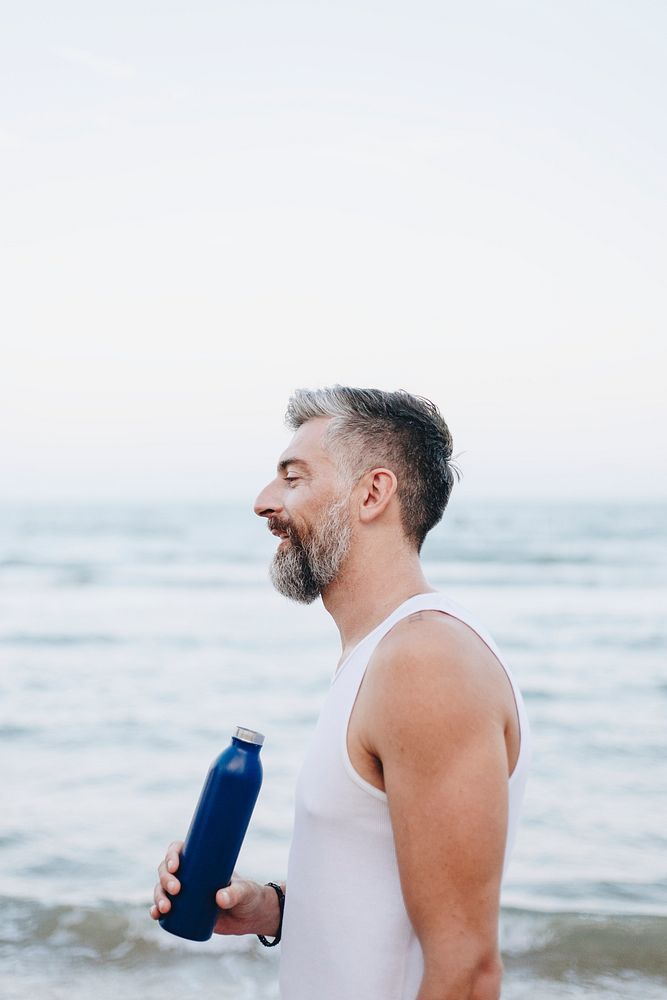 Man drinking water to rehydrate