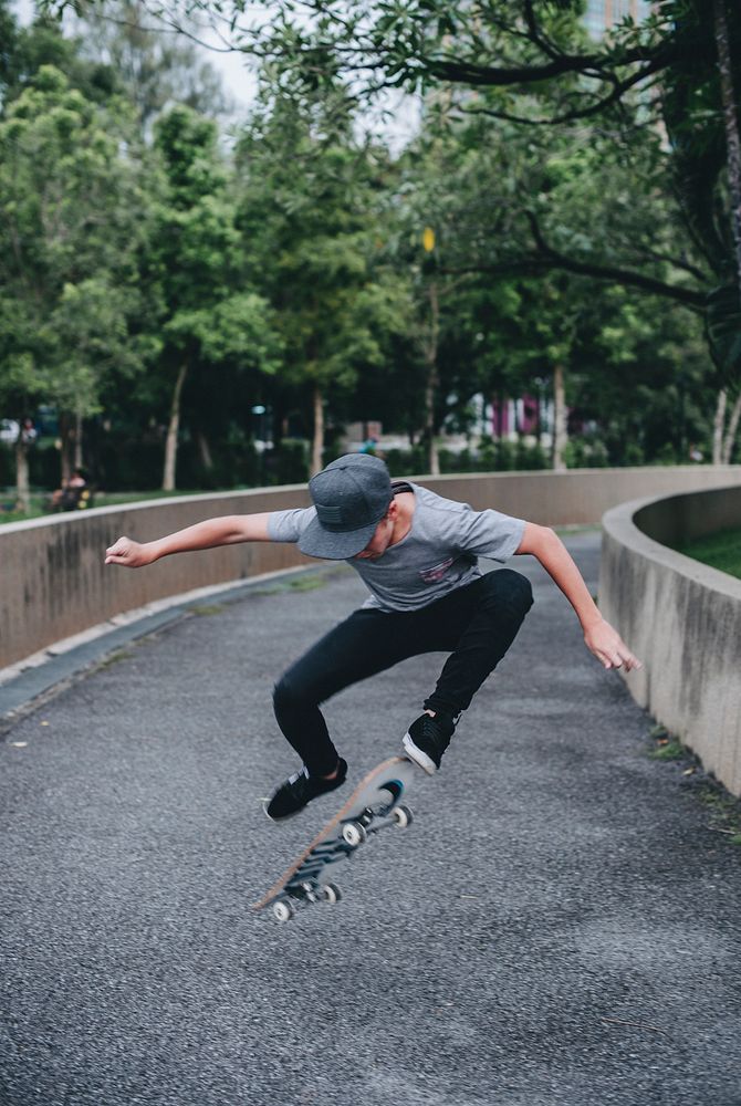 Young boy skateboarding in the street