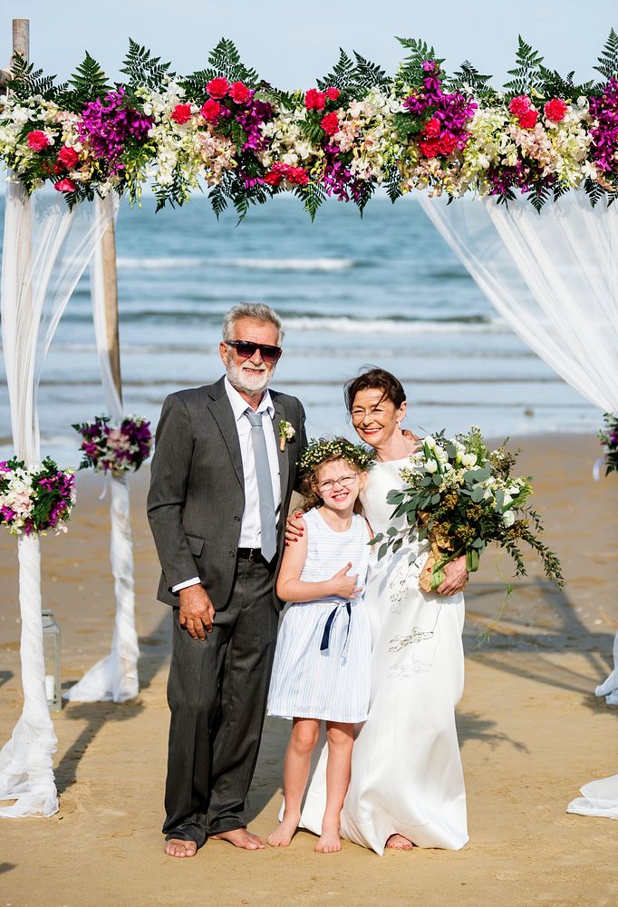 Cheerful newlyweds at their beach wedding