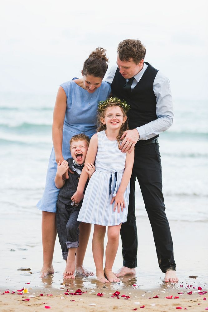 Cheerful family at beach wedding ceremony