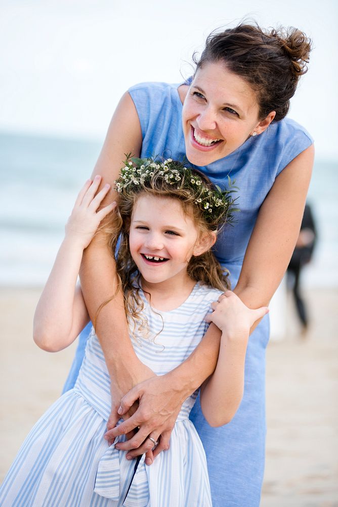 Mother and daughter at a beach wedding