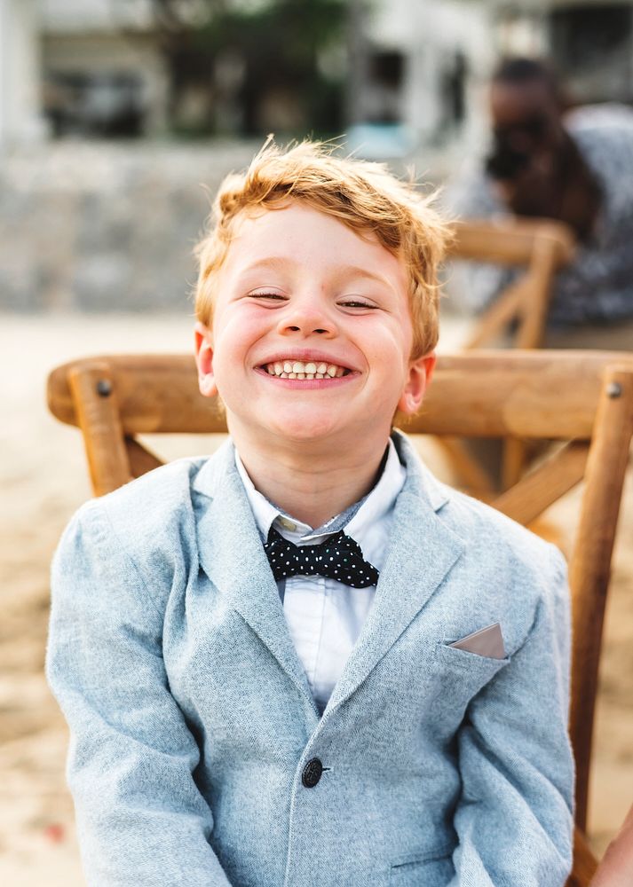 Happy boy at a beach wedding