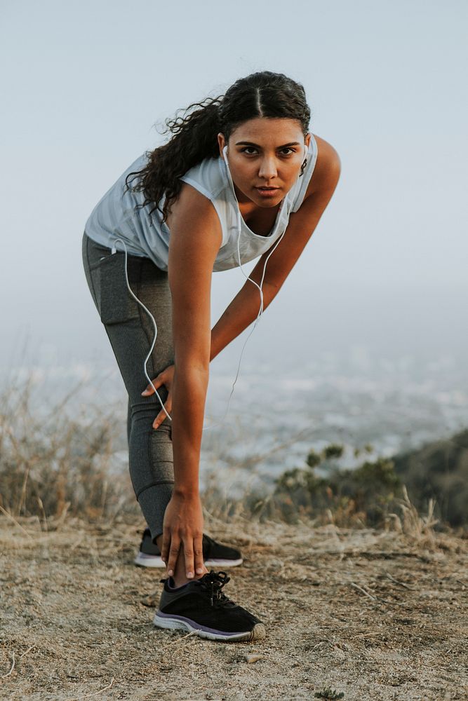 Woman stretching on a hill in LA