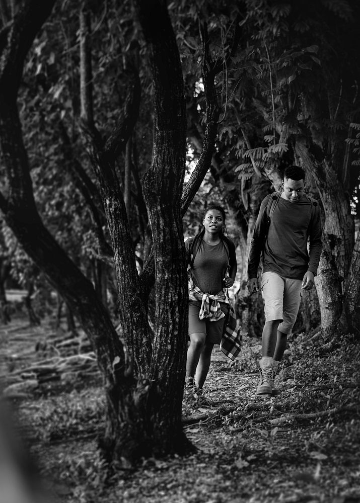 Couple trekking in a forest