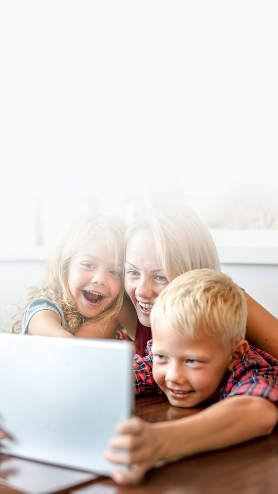 Blonde mom and kids making a video call on a tablet text space 
