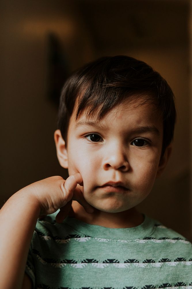 Skeptical face portrait of a kid