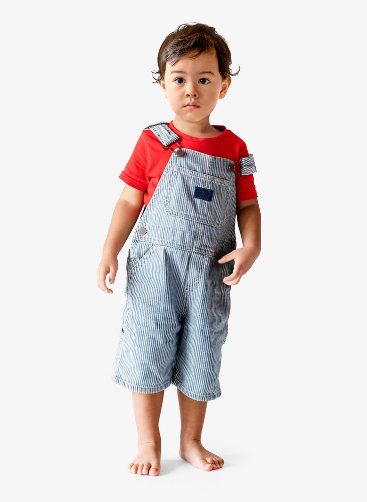Cute little boy in dungarees