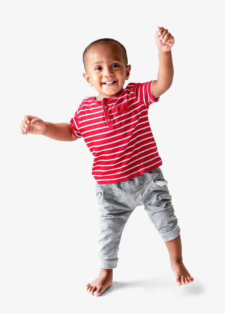 Cheerful young boy learning how to walk