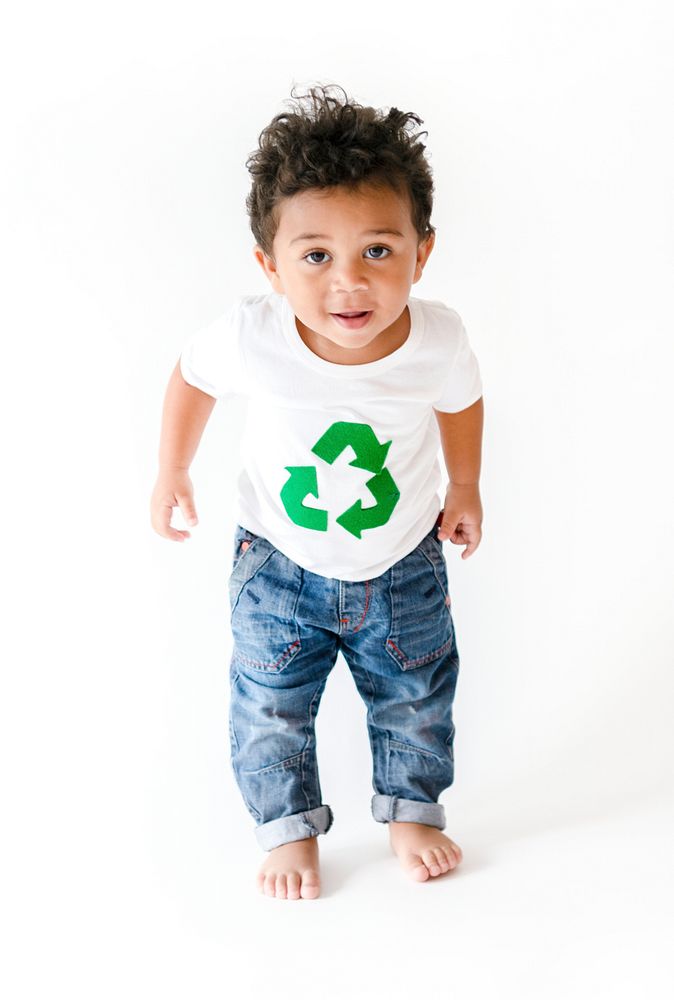 Young boy wearing a t-shirt with recycling symbol