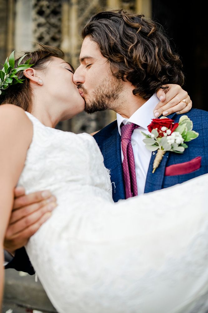 Groom lifting up his beautiful bride