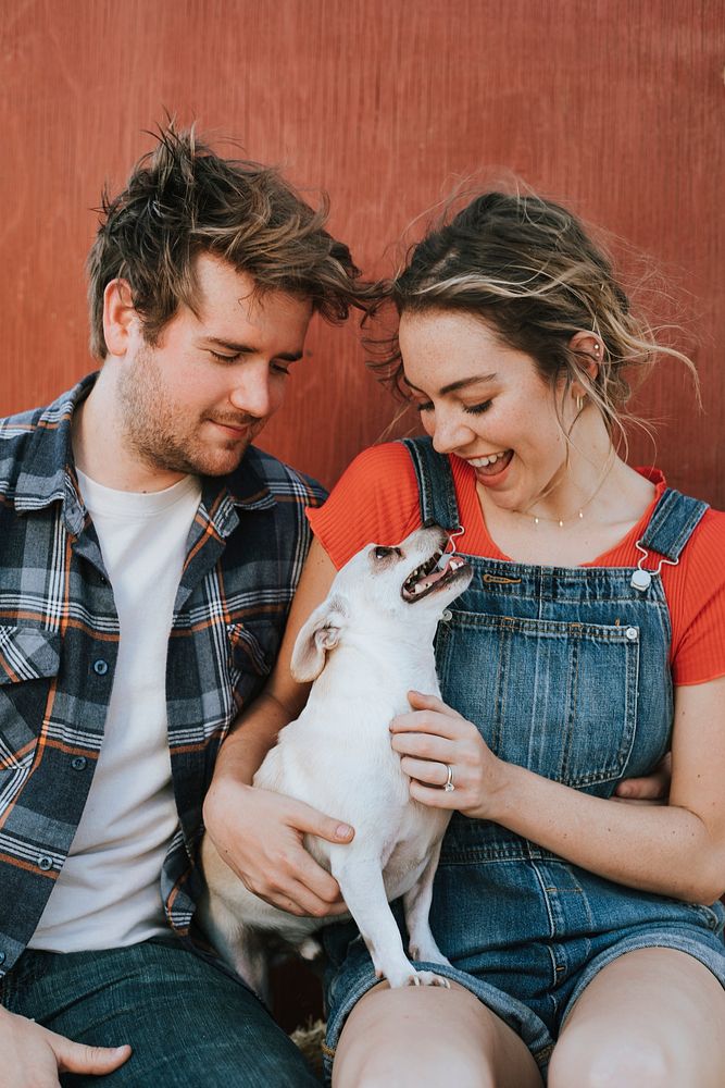 Couple with their adopted Chihuahua dog