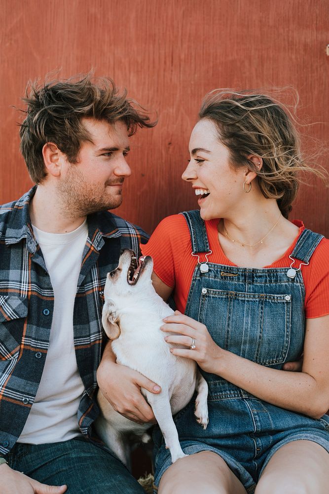 Couple with their adopted Chihuahua dog