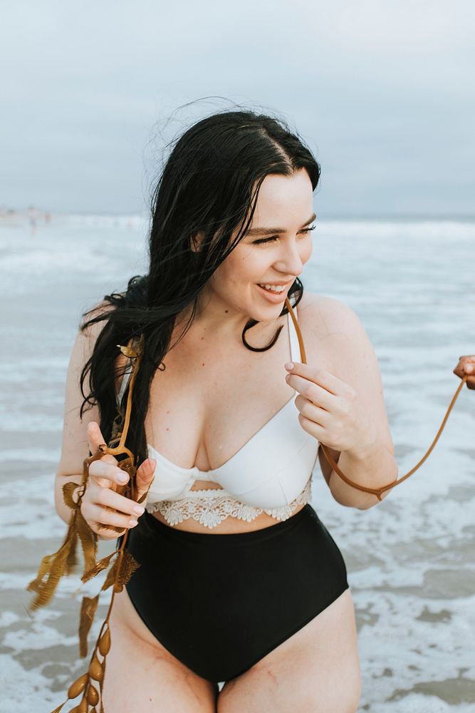 Cheerful plus size woman at the beach