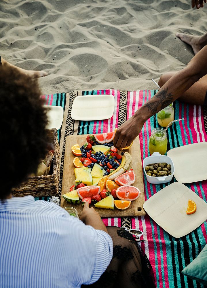 Friends having a beach picnic