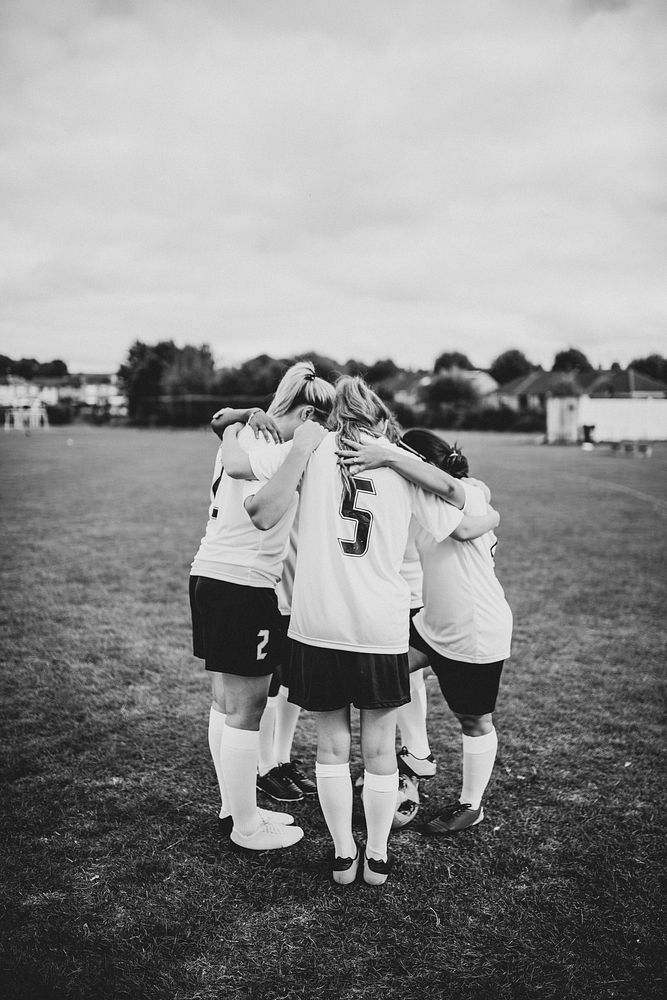 Football team huddling before a match