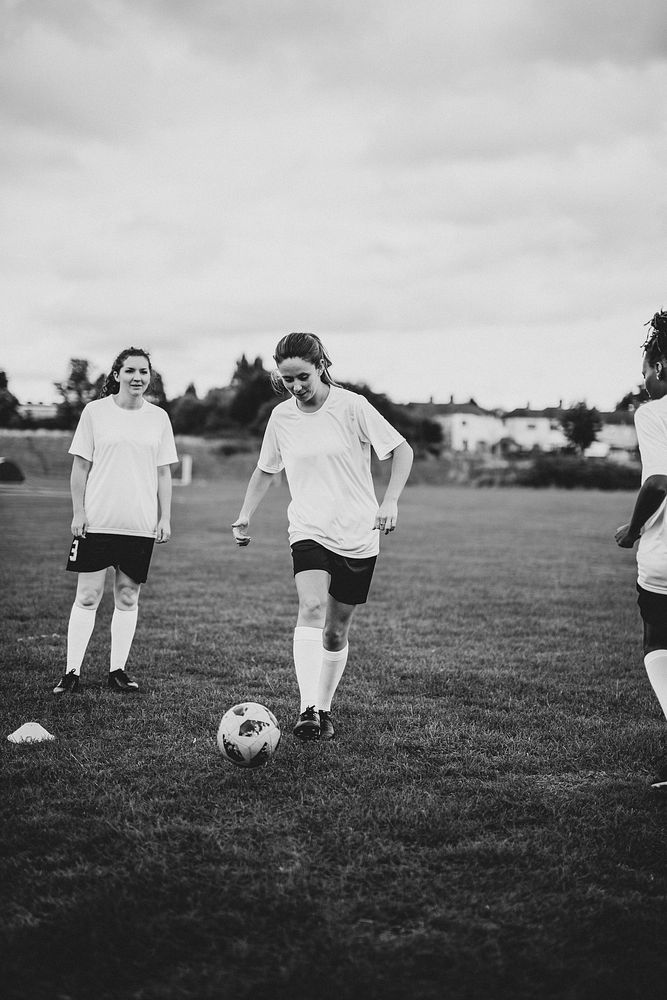 Female football players playing a game