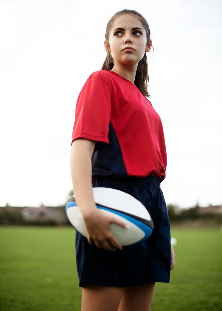 Confident female rugby player on the field