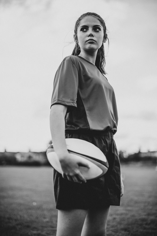 Confident female rugby player on the field