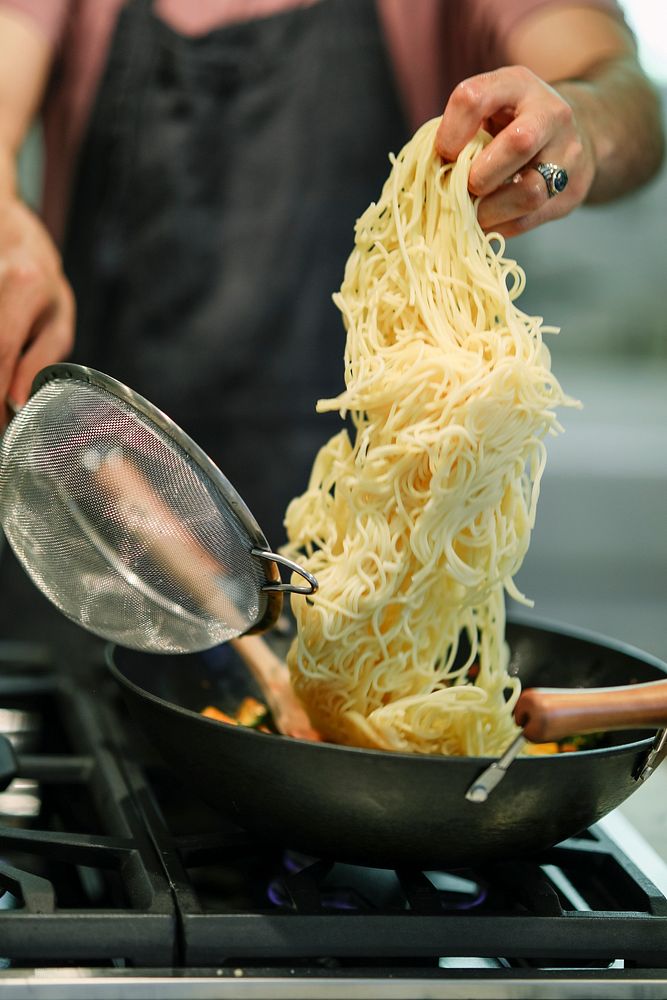 Chef cooking up a vegan pasta dish