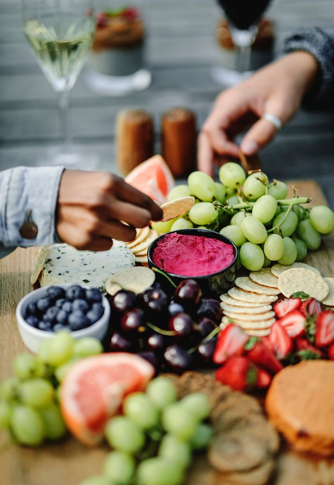 Closeup of a vegan cheese and fruit platter