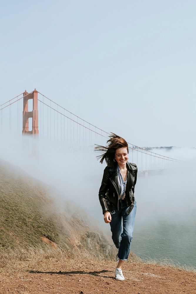 Woman running with a view of the Golden Gate Bridge