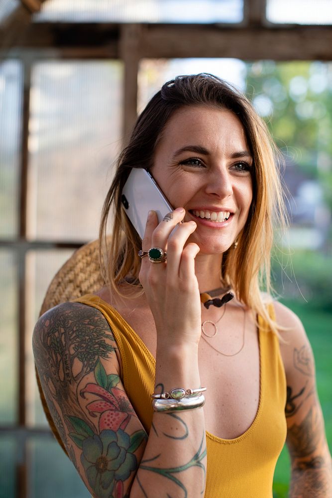 Cheerful woman taking on the phone