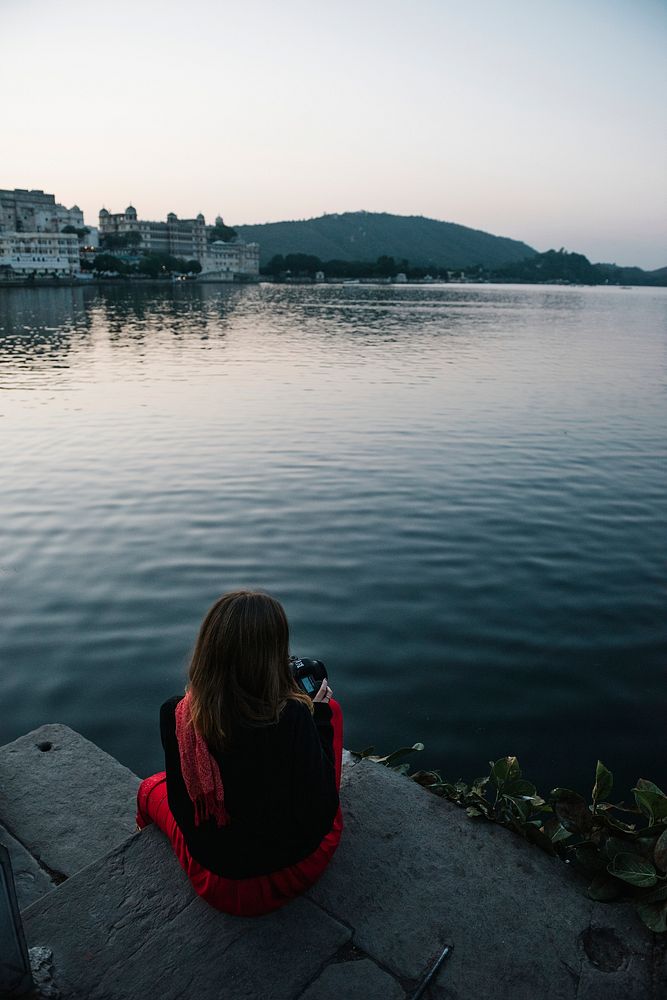 Western woman enjoying a view of Taj Lake in Udaipur