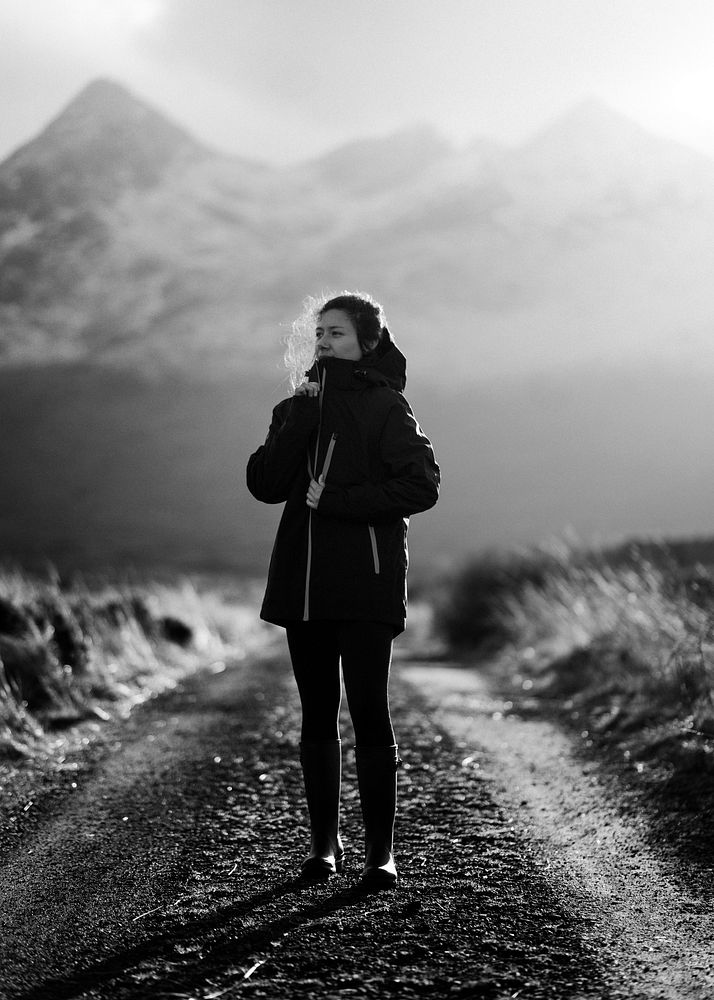 Woman on a road in Glen Etive, Scotland