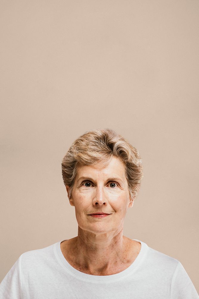 Portrait of an elderly woman in a white tee