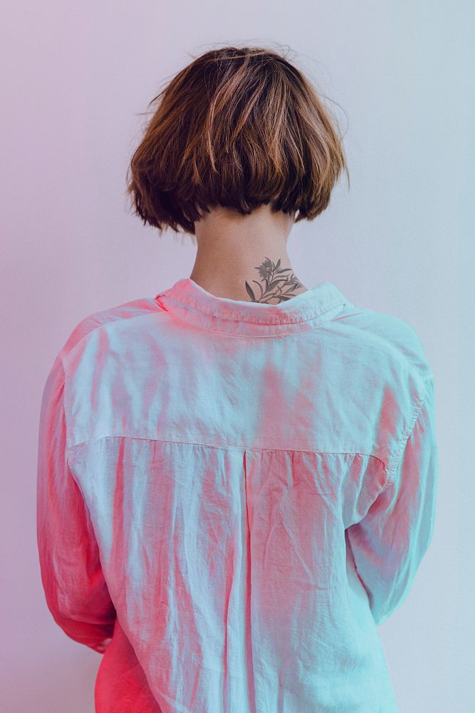 Rear view of a short dyed hair in a white shirt