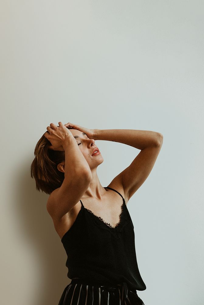 Woman running her fingers through her hair