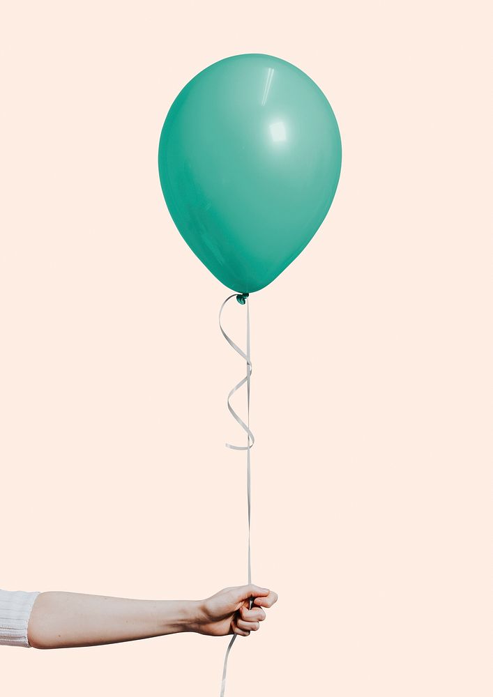 Woman holding a single balloon