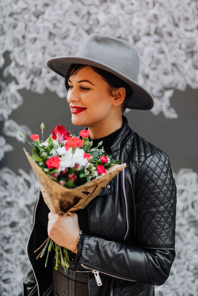 Joyful woman holding a bouquet of flowers