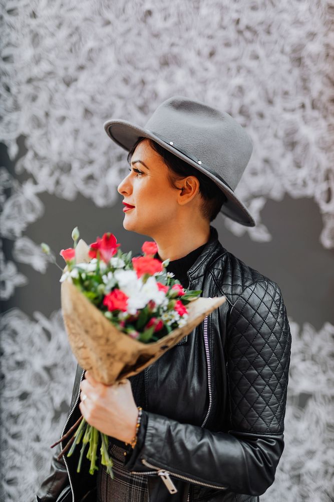 Joyful woman holding a bouquet of flowers