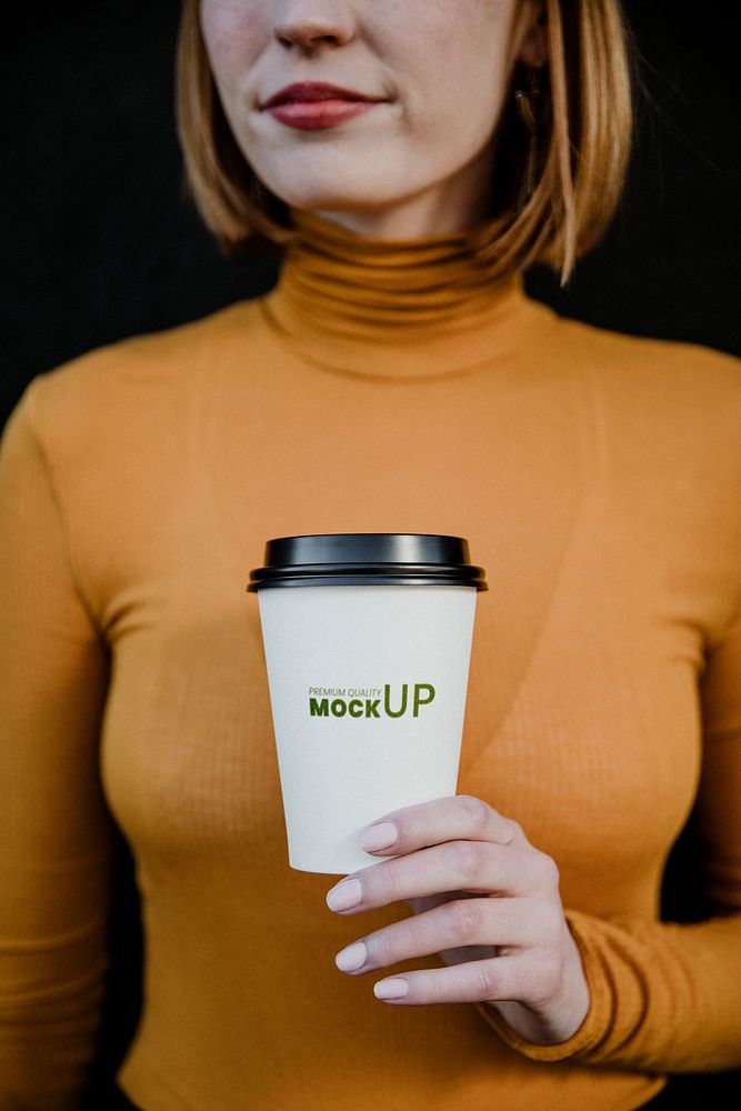 Woman wearing a turtleneck with a takeout paper cup mockup