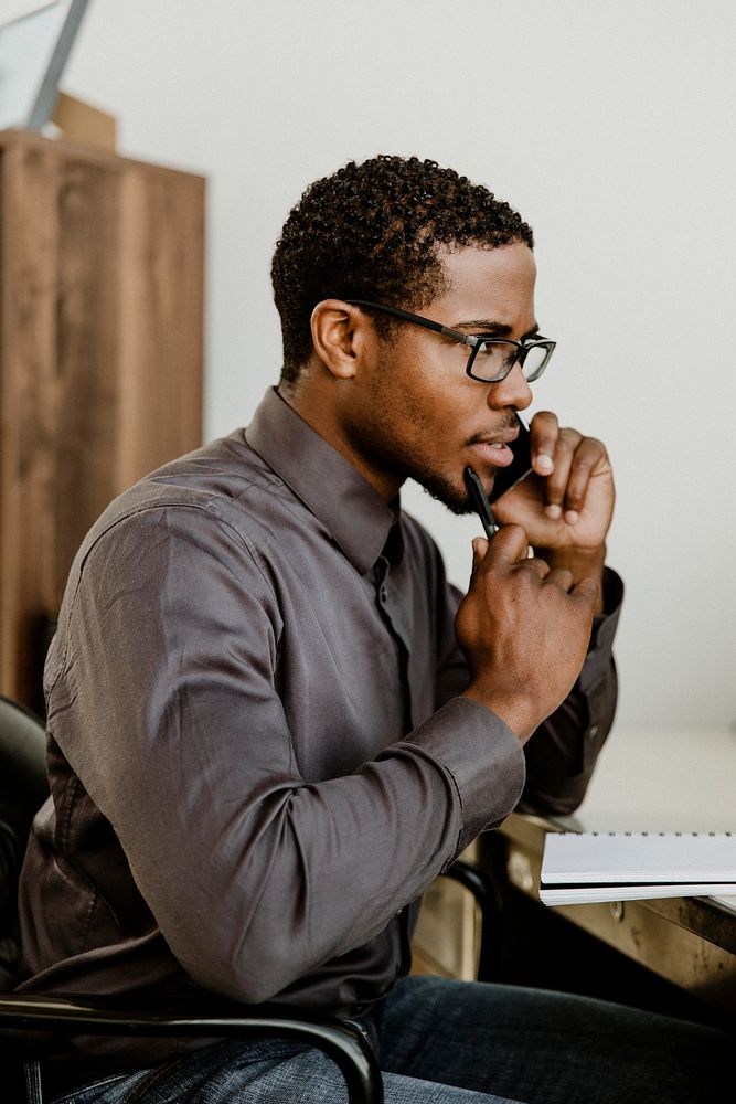 Black businessman talking on the phone