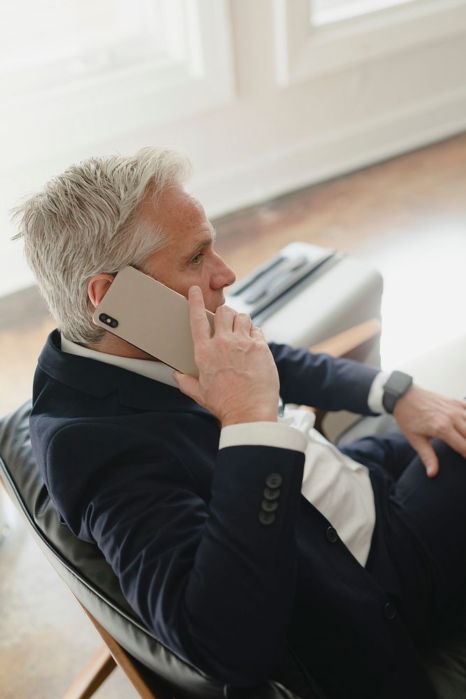 Successful senior businessman talking on the phone