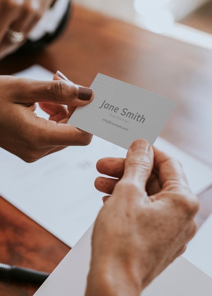 Woman handing a business card mockup