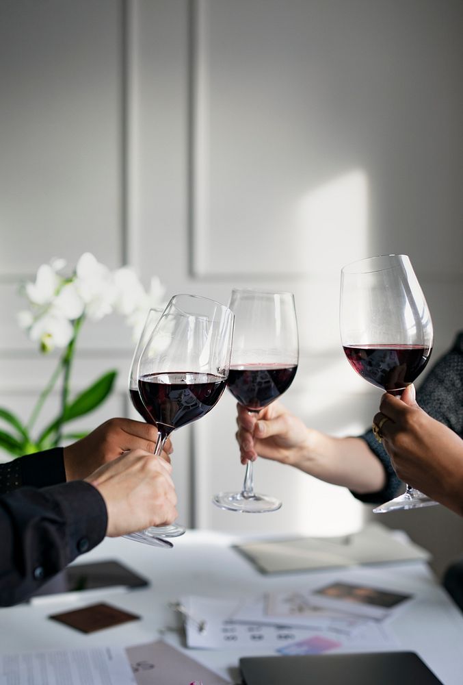 Business people toasting red wine in the office