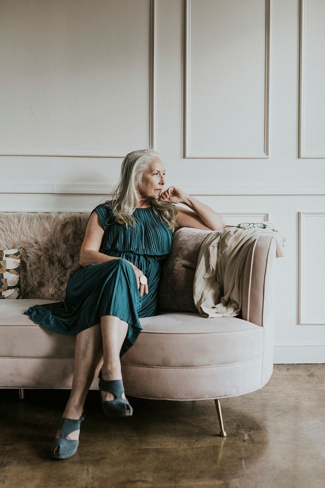 Classy senior woman sitting on the couch