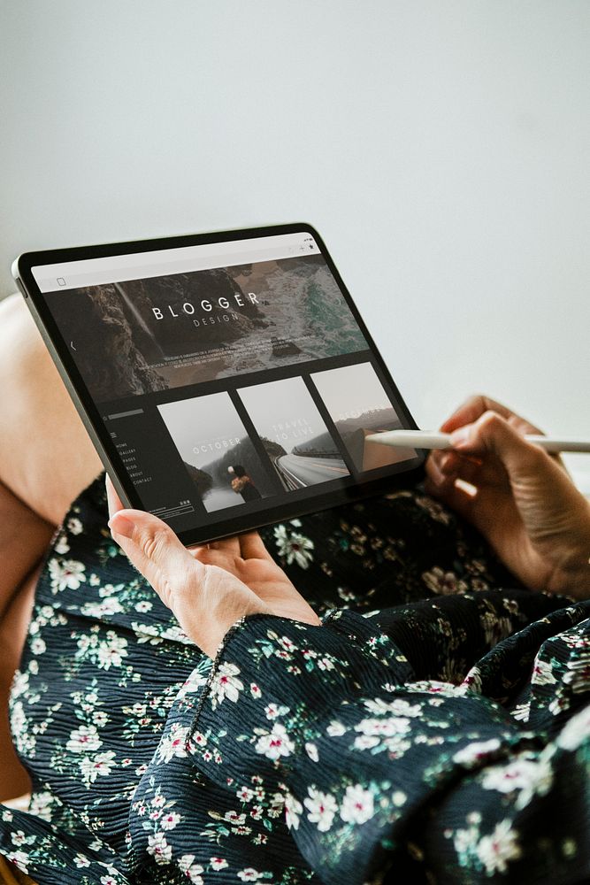 Woman blogging on a digital tablet mockup