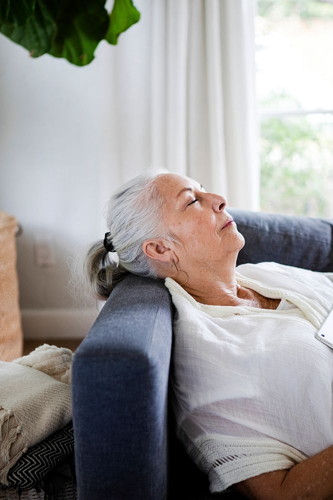 Elderly woman napping on a couch