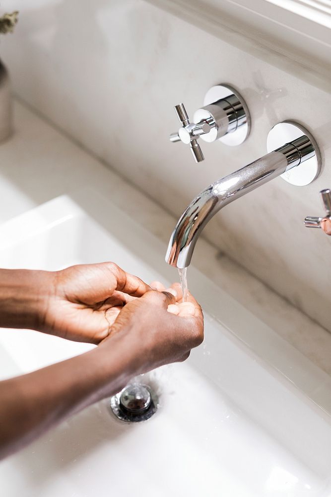 Black woman washing her hands