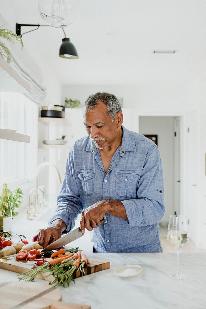 Elderly man cooking in a kitchen