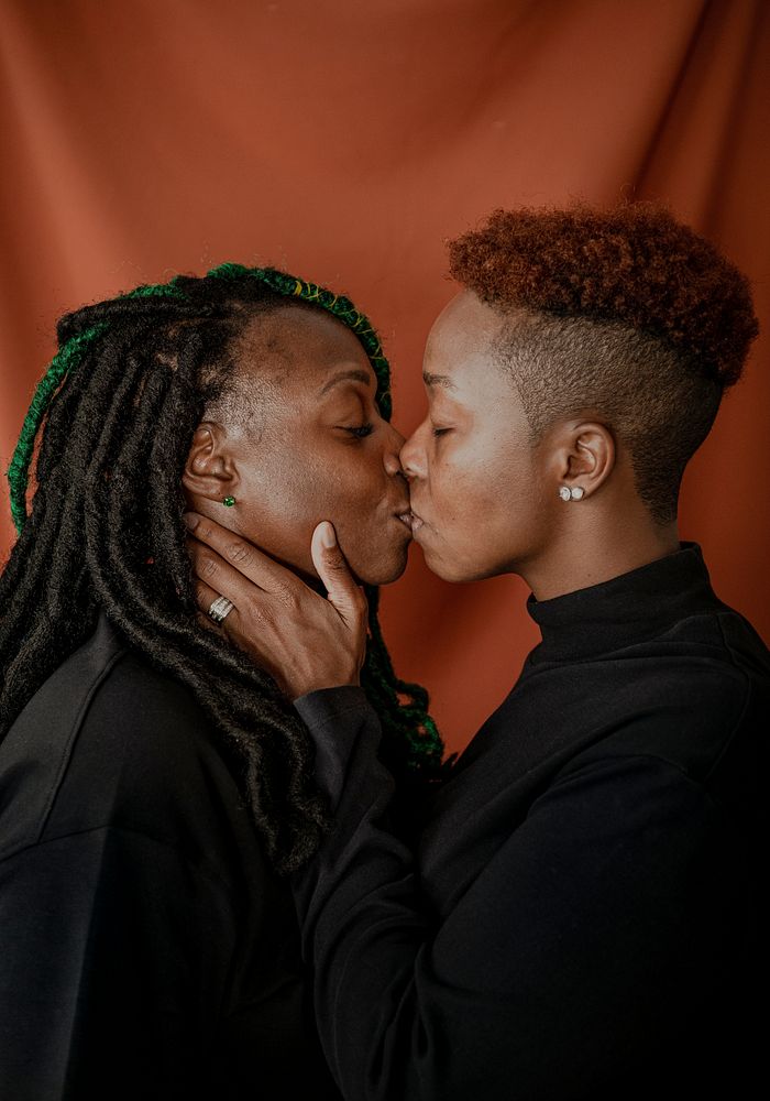 Happy lesbian couple kissing passionately