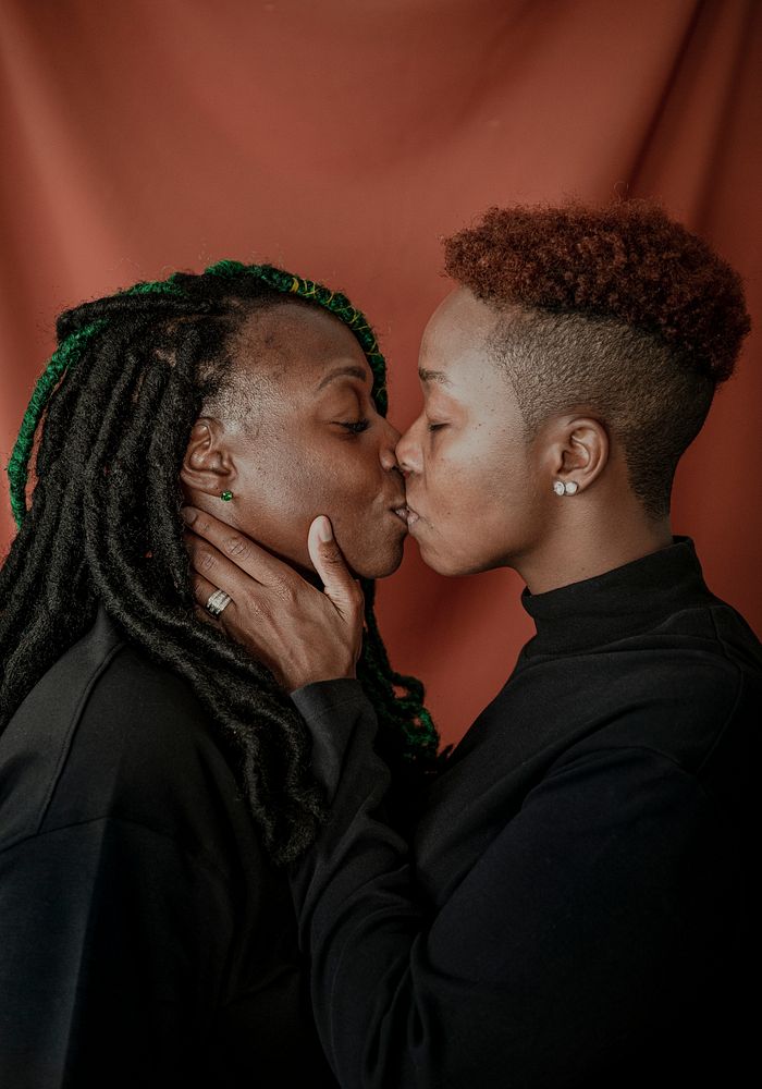 Happy lesbian couple kissing passionately