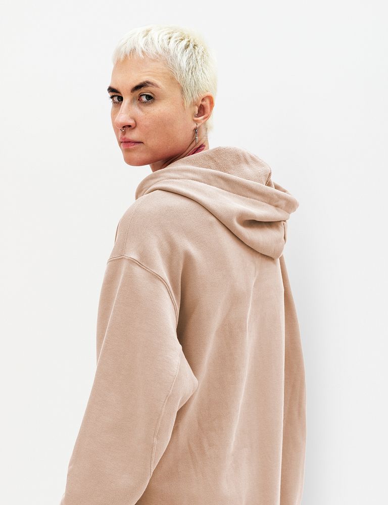 Cool woman in a beige hoodie