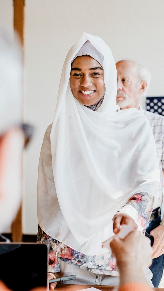 American Muslim queuing at a polling place