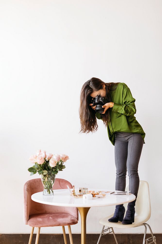 Female photographer shooting beauty products on the table