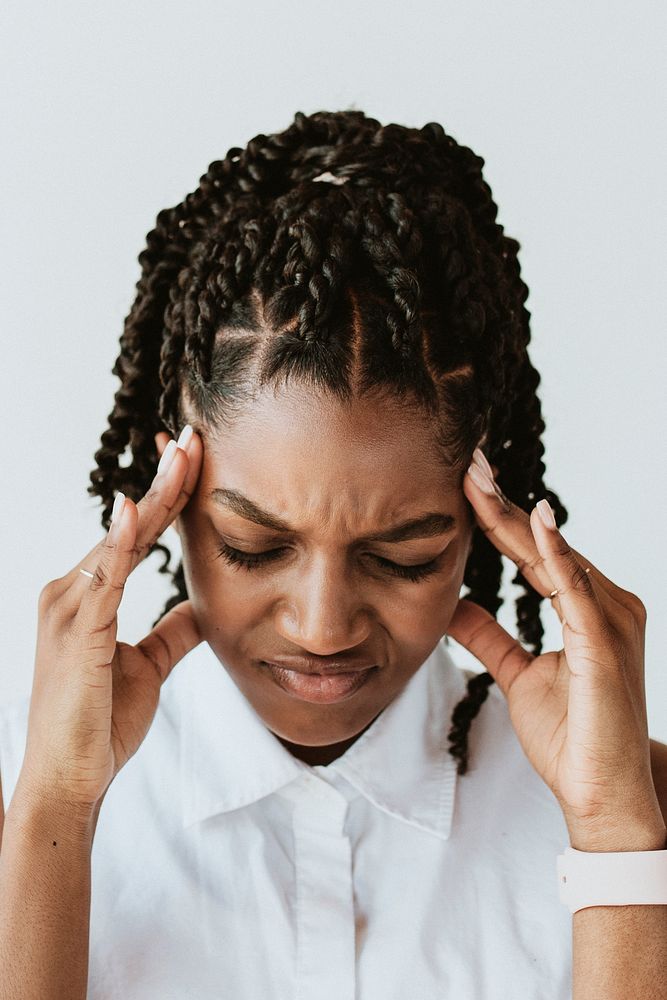 Stressed woman touching his head